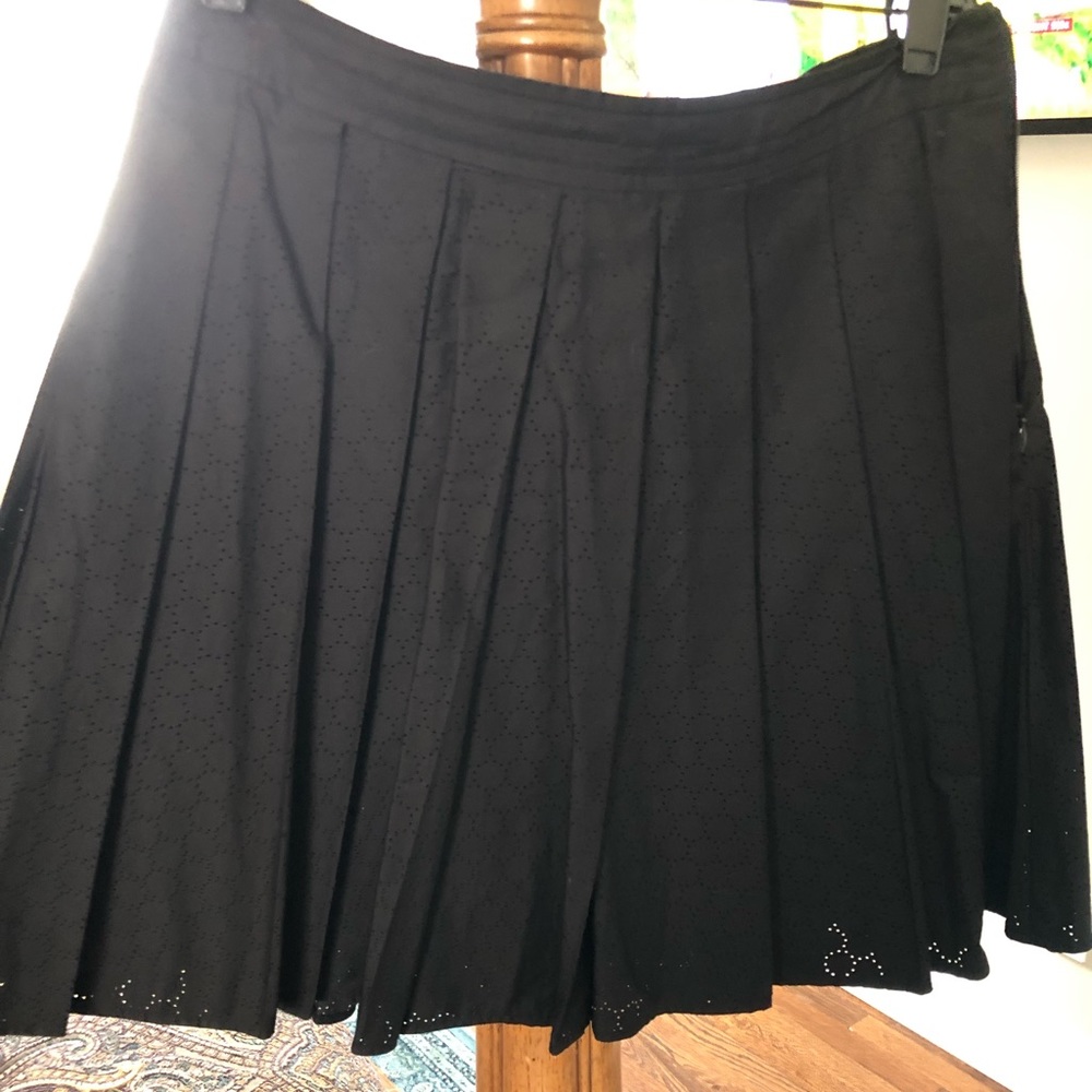 Black pleated skirt worn once very cute The fabric is perforated